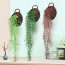 Rattan wall decoration with leaves and golden bell