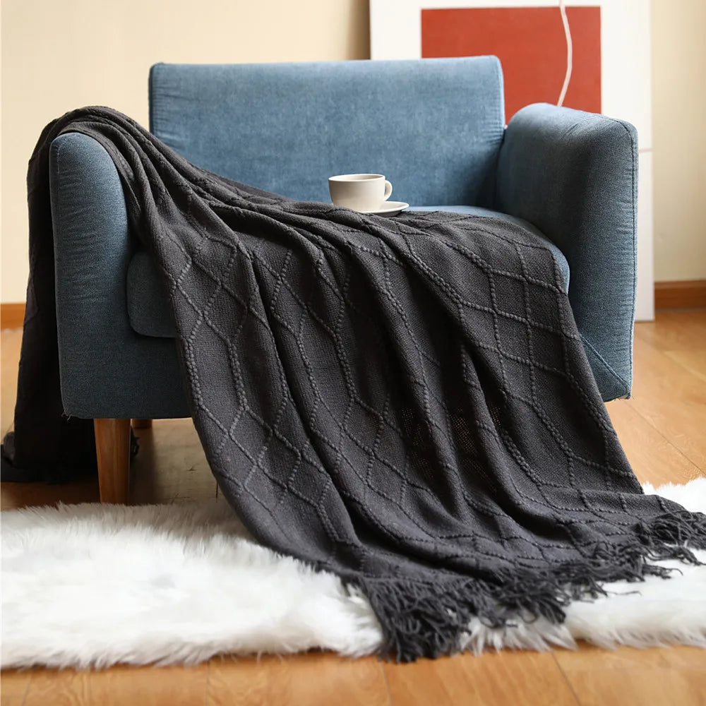 Nordic style knitted throw with pom-poms for living room