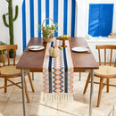 Bohemian table runner with Aztec patterns and beige tassels