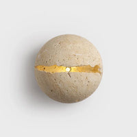 Retro wall light in natural stone dinosaur egg design