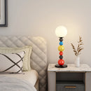 Modern floor lamp with colourful beads and glass shade