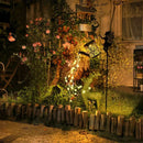Solar watering can with garden lights and fairy statues