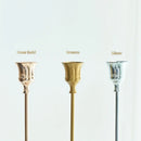 Set of three gold brass candle holders for weddings and dinners