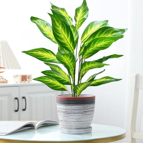 Large artificial tropical plant with leaves for indoor decoration