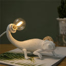 Modern and playful chameleon lizard desk lamp in resin