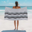 Absorbent lightweight beach towel with abstract wave pattern