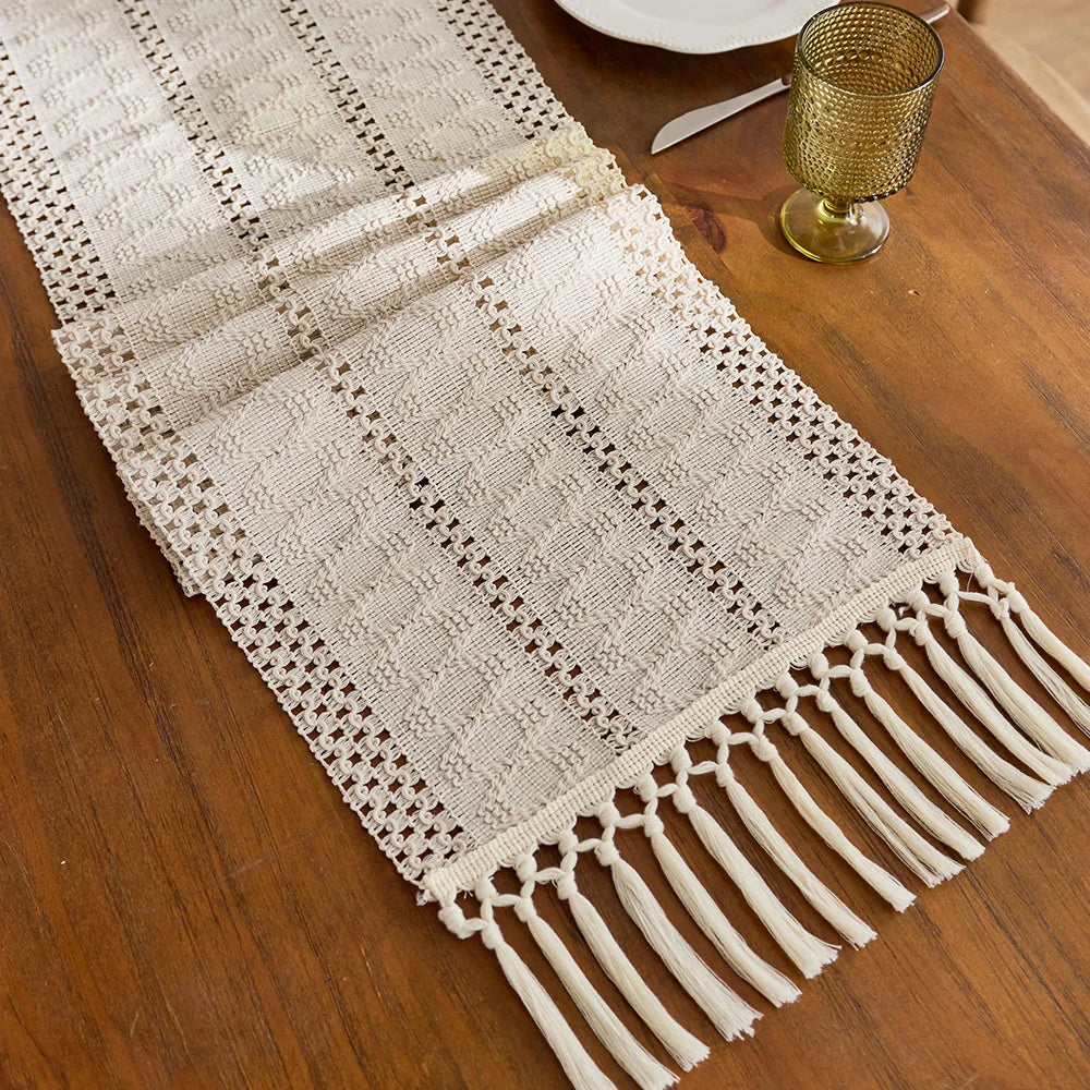 Beige boho woven table runner with tassels and geometric pattern