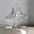 glass vase with decorative stones for flowers and terrarium