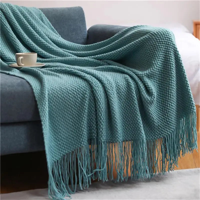 Nordic knitted throw with pompoms for sofa or bed
