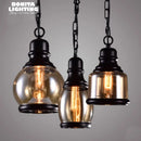 Retro industrial pendant with amber glass and hemp rope