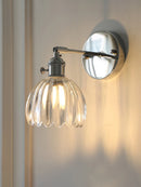 Contemporary chrome glass and iron wall light with adjustable arm