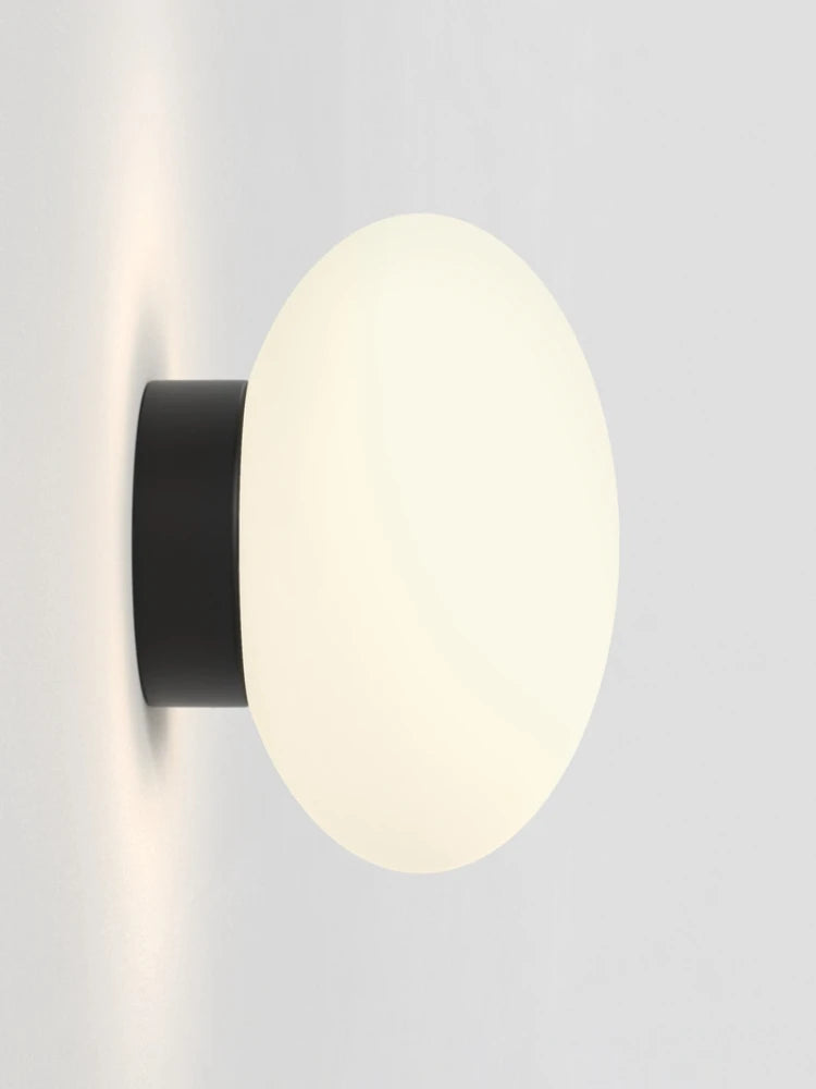Minimalist glass wall light for modern interiors