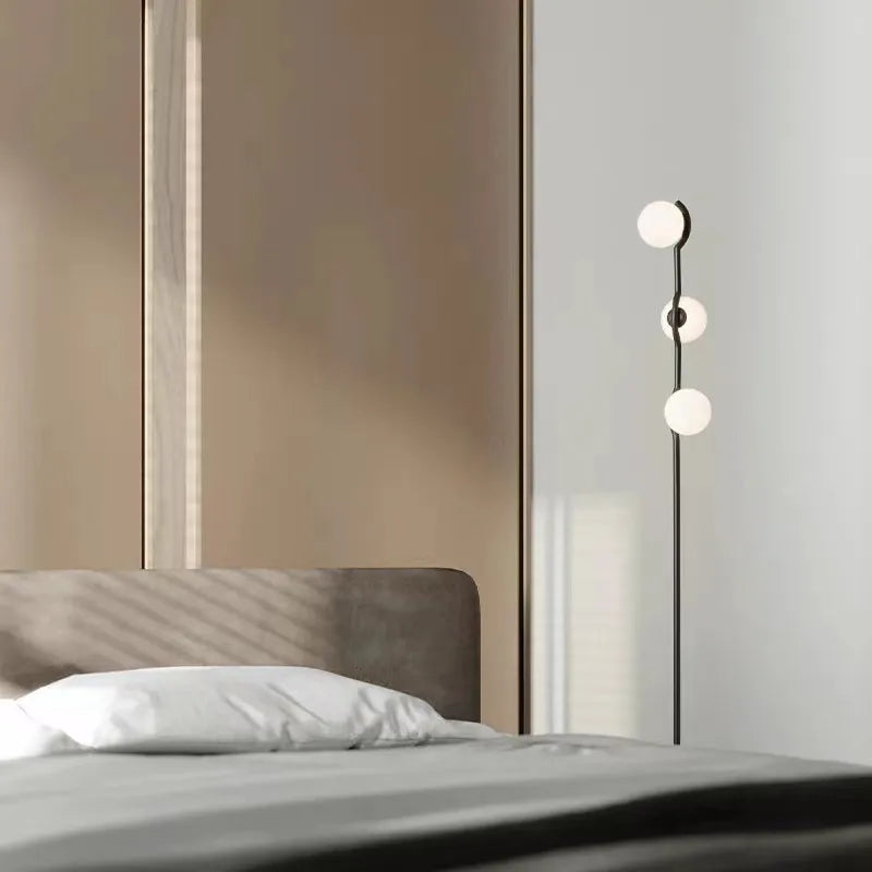Post-modern Nordic design floor lamp with three white glass heads