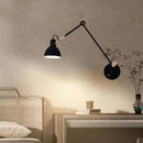 Vintage black and gold metal wall light for elegant interiors