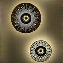 Carved copper wall light with decorative LED lighting