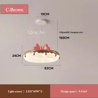 Donut-shaped chandelier with pink bow for children's decor