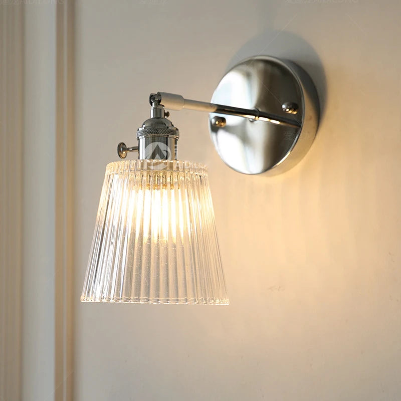 Contemporary chrome glass and iron wall light with adjustable arm