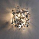 Modern stainless steel wall light with decorative leaves
