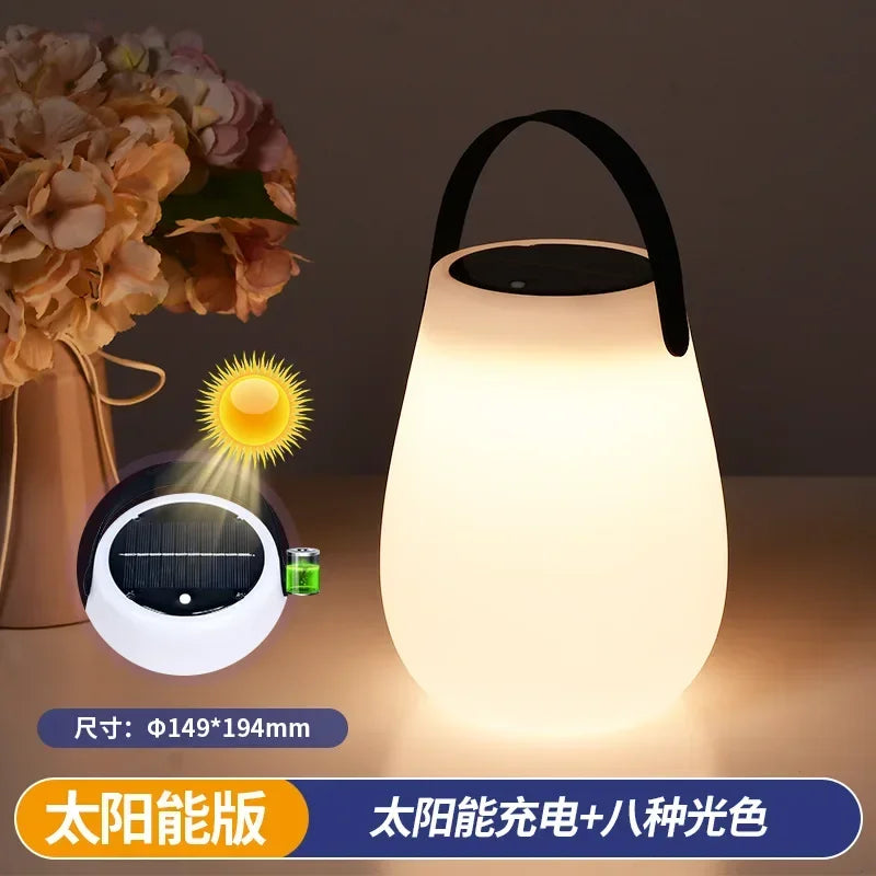 Rechargeable solar camping lamp with silicone handle