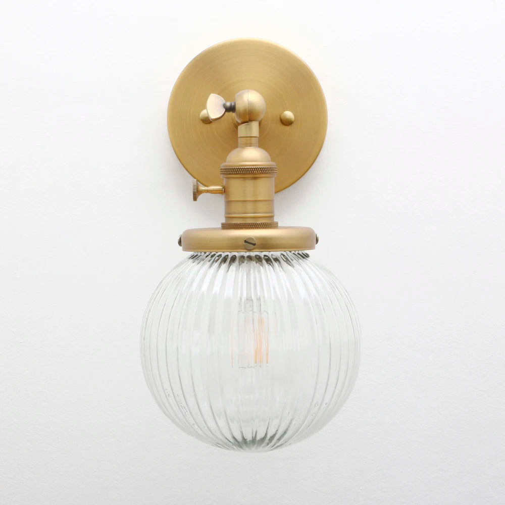 Phansthy vintage industrial wall light with round glass shade