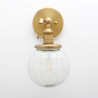 Phansthy vintage industrial wall light with round glass shade