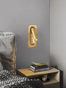 Rotating brass LED wall light with USB switch