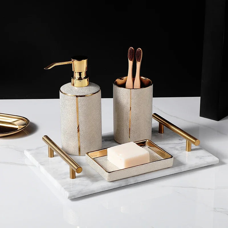 Ceramic soap dispenser and gold bathroom accessories set