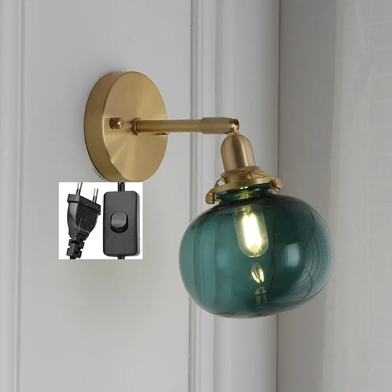 Modern wall light with pull chain and glass globe
