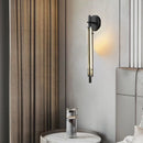 Minimalist brass wall light with clear glass and 3 brightness levels