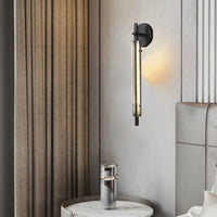 Minimalist brass wall light with clear glass and 3 brightness levels