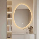Irregular shaped LED mirror for smart dressing rooms and bathrooms