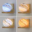 Modern wooden wall light with planet LED shade