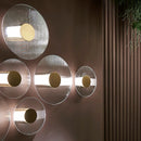 Elliptical glass and gold metal wall light
