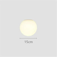 Modern LED wall light with round white glass shade