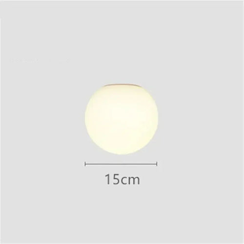 Modern LED wall light with round white glass shade