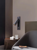 Rotating brass LED wall light with USB switch