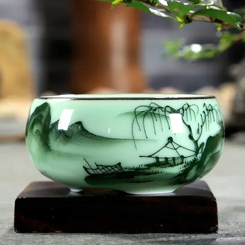 hand-painted celadon teacup with lotus and carp