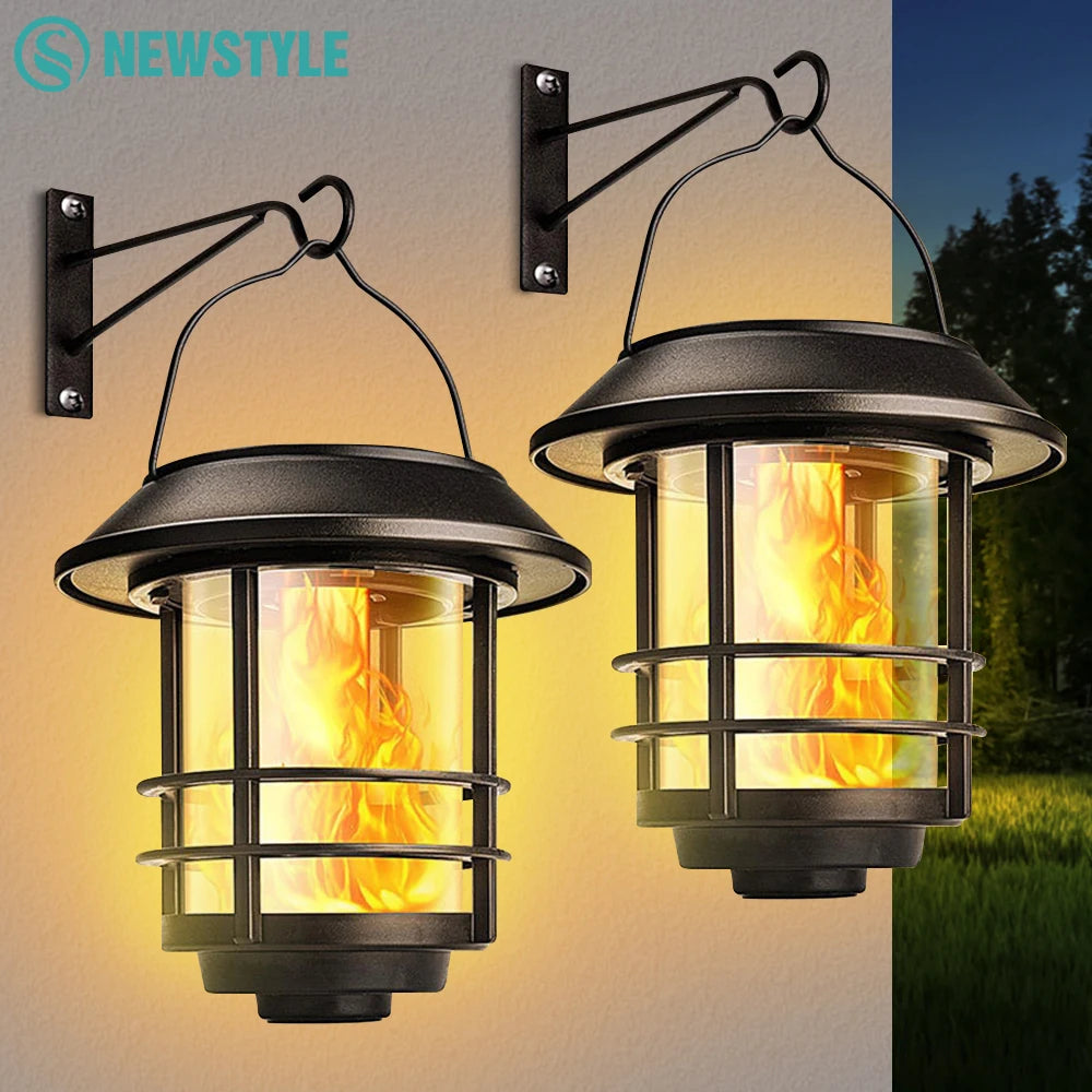 Hanging solar lantern with flickering flame for outdoor use