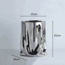 ceramic vase with silver frills for decorative flowers