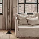 Minimalist LED floor lamp with long metal arm and adapted plug