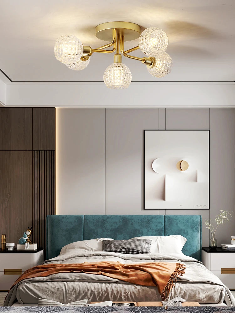 Modern glass ceiling light with round gold wave shade
