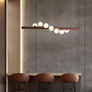 Modern glass and walnut wood chandelier for indoor use