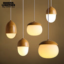 Modern glass and wood pendant light with mushroom design
