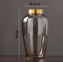 modern glass vase with metal base for floral decoration