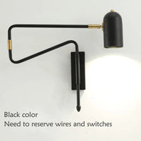 Industrial style adjustable wall light in black and gold