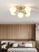 Modern glass ceiling light with round gold wave shade