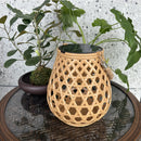 Decorative outdoor solar lantern with woven bamboo effect