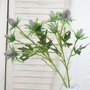 Decorative artificial sea holly flowers in pink and violet