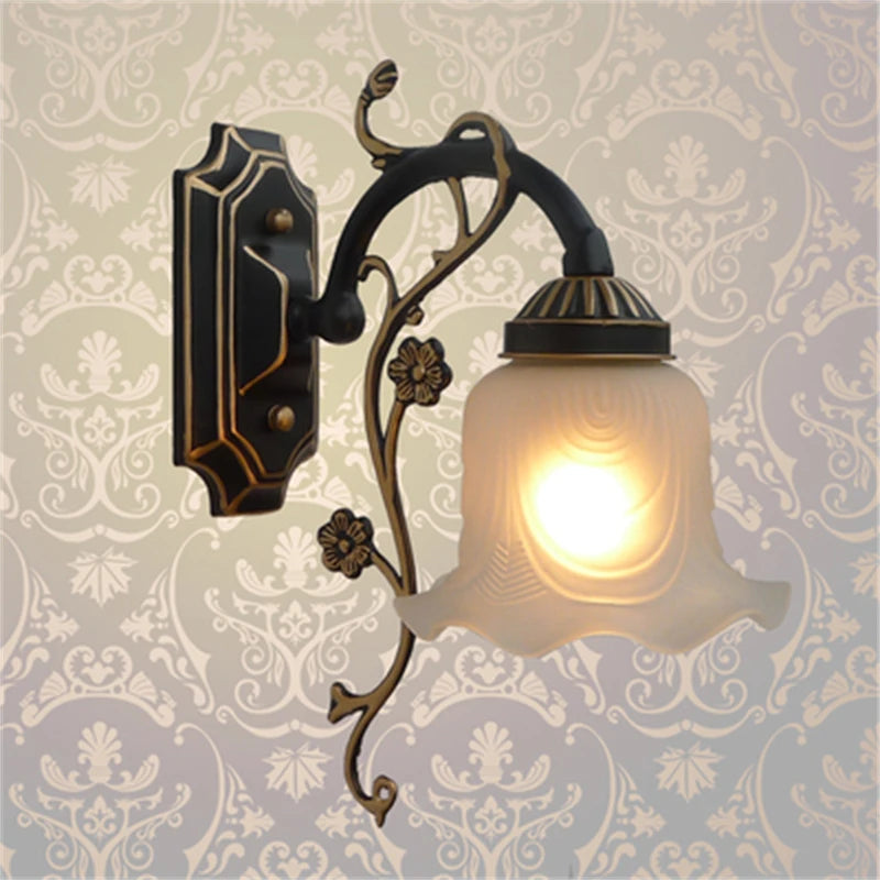 Vintage wrought iron chandelier with decorative glass shade