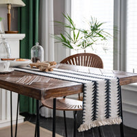 Beige boho table runner with tassels and geometric patterns